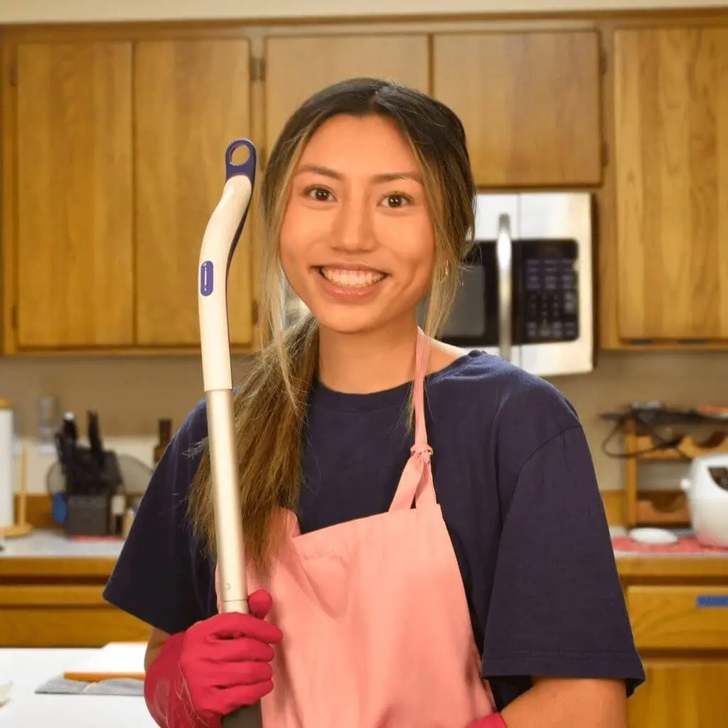 Professional housekeeper cleaning a kitchen